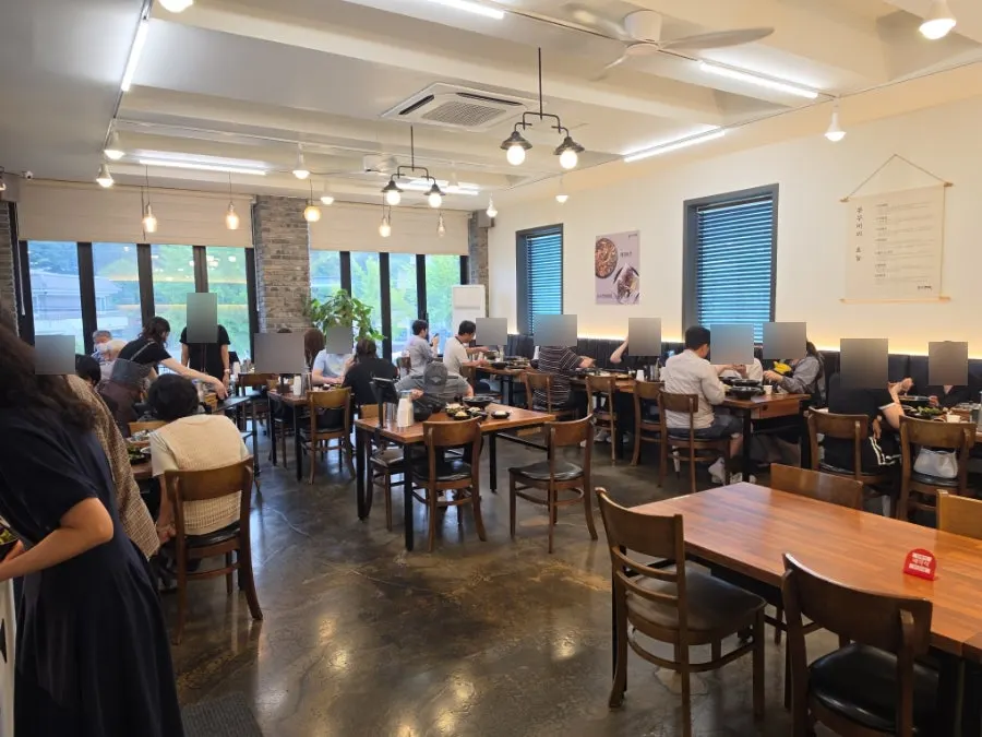 Open-style table seating busy with lunchtime customers