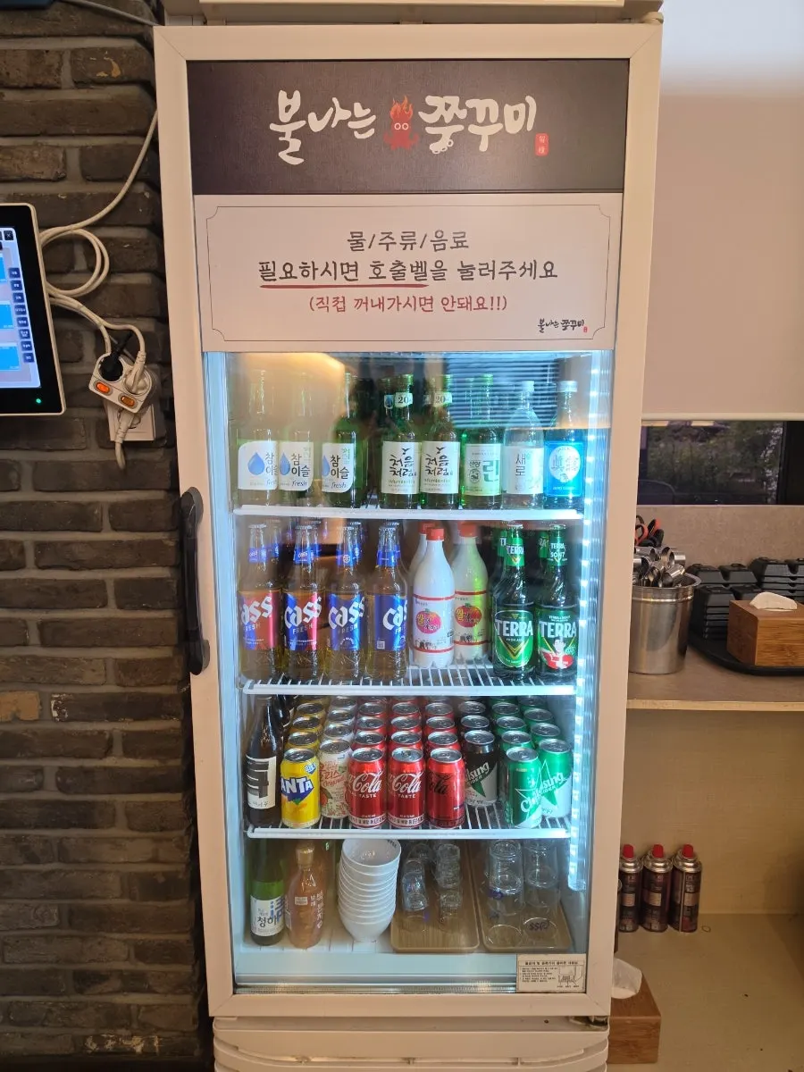 Fridge stocked with drinks and alcohol