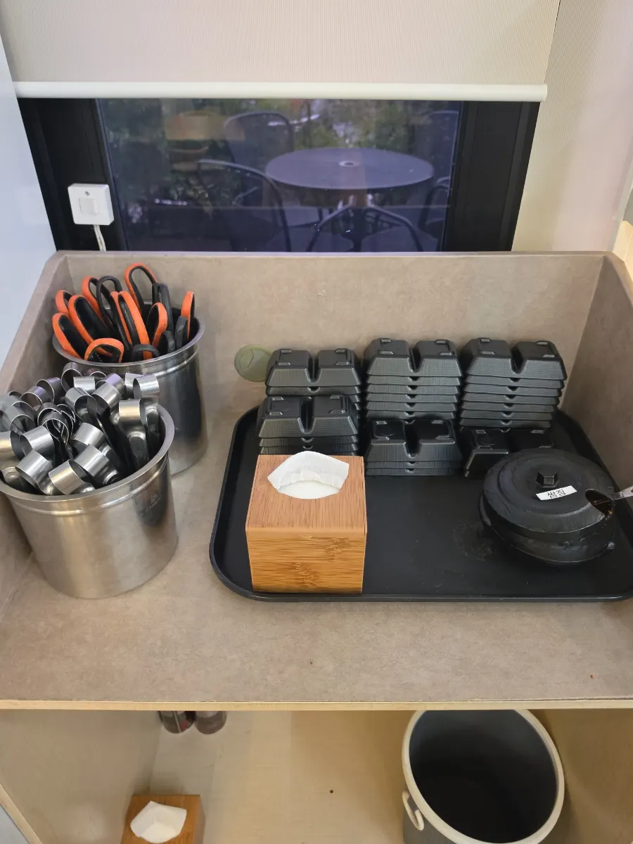 Self-bar with small dishes, tongs, and scissors