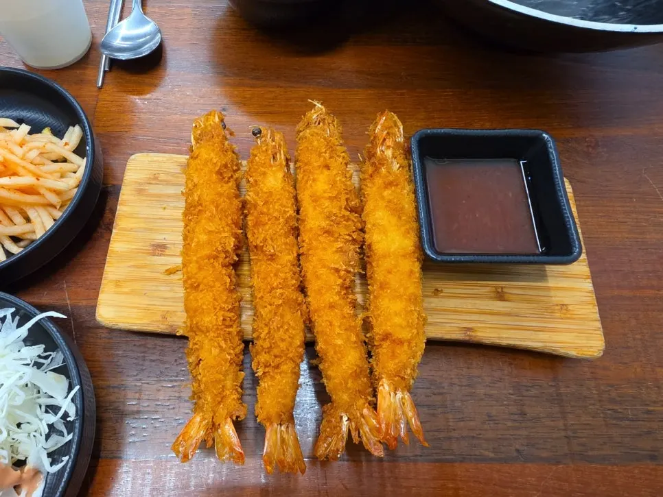 Whole shrimp bigger than a hand with shrimp sauce