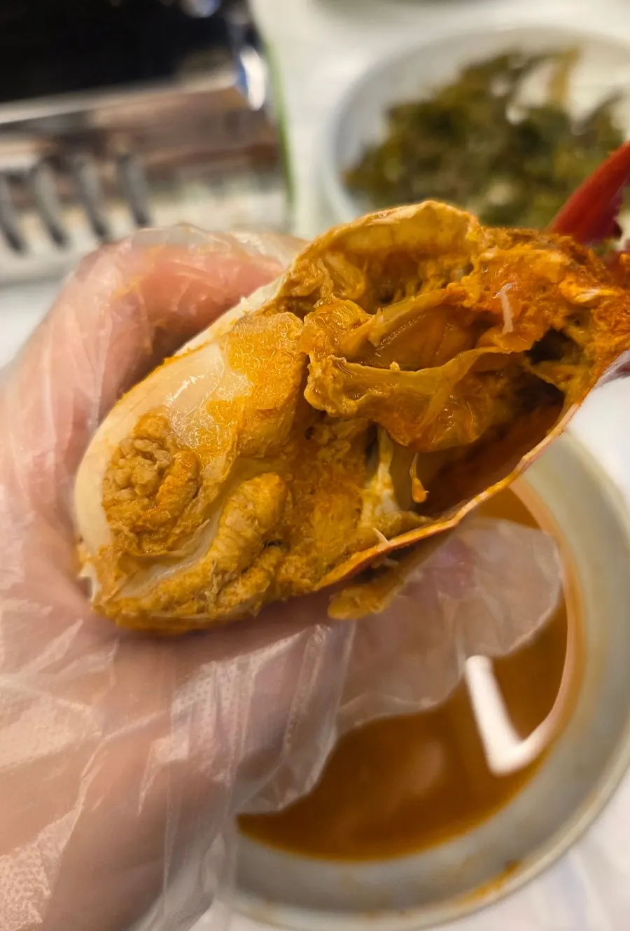A large crab inside the boiled crab soup