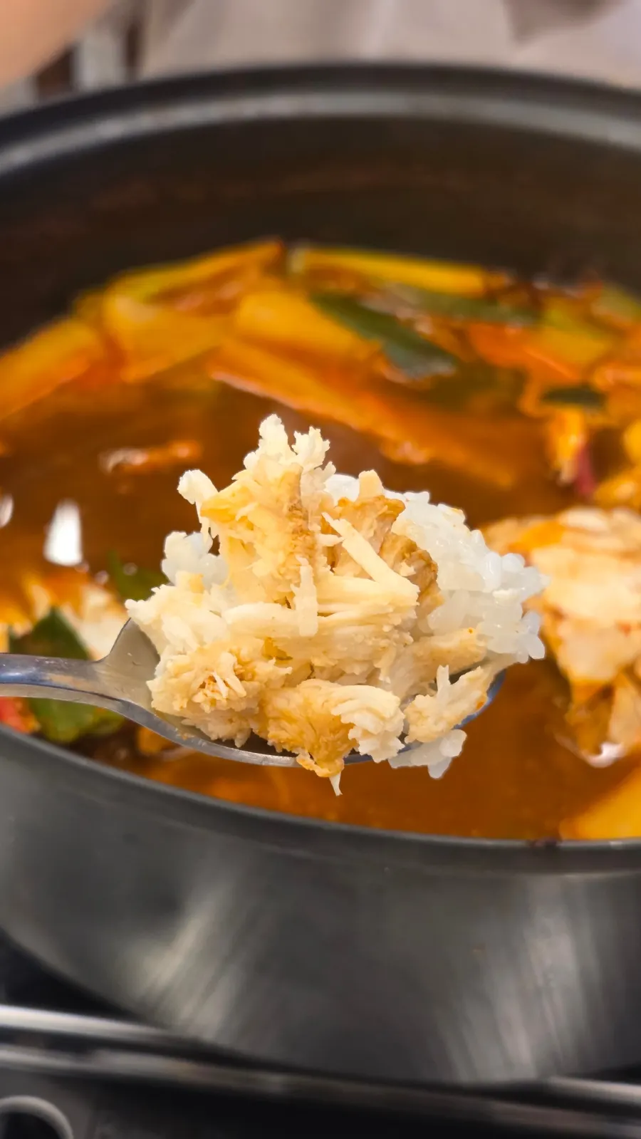 Crab meat piled onto stone-pot rice