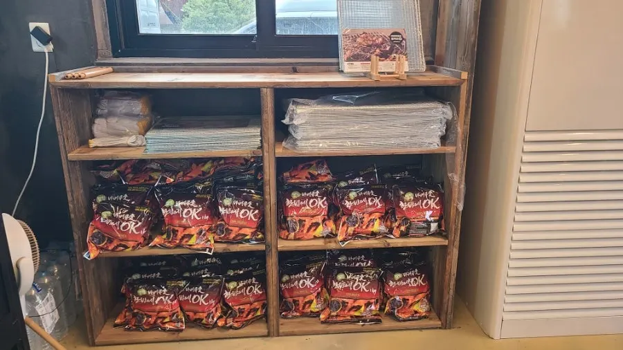 Store shelf stocked with snacks and instant rice