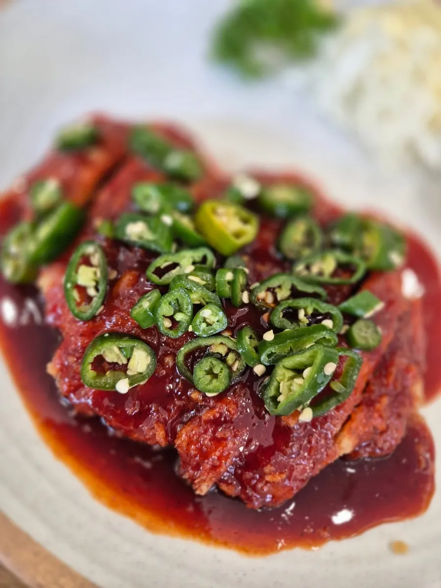 Spicy pork cutlet set topped with red sauce and cheongyang chili