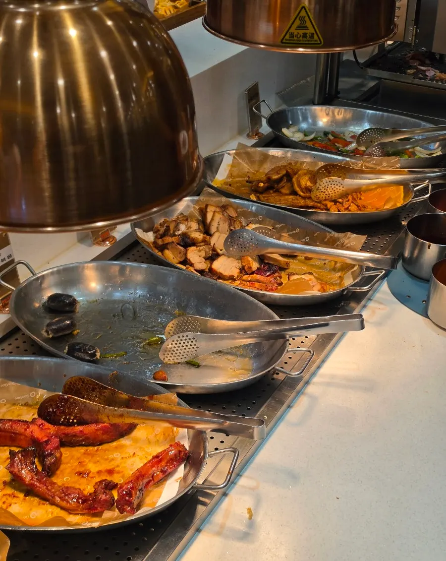 Hot food corner displaying various meats
