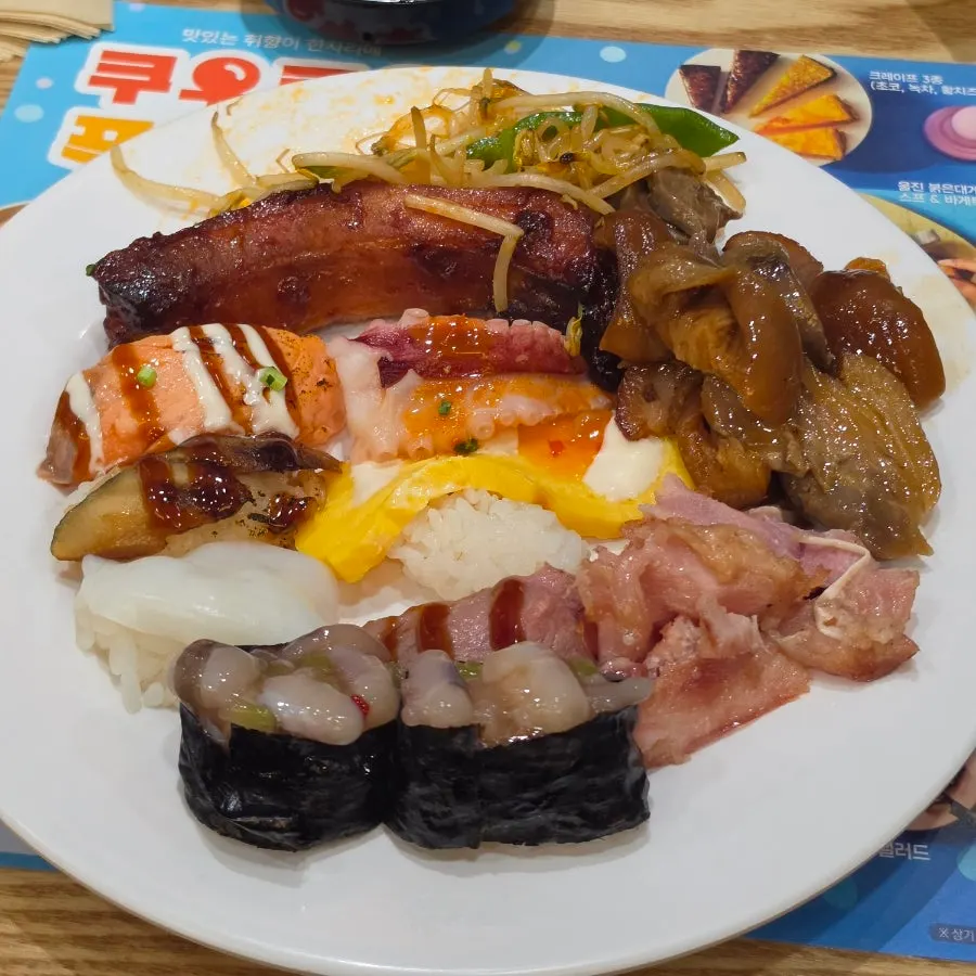 Second plate with sushi, gunkan rolls, pork ribs, and pork trotter