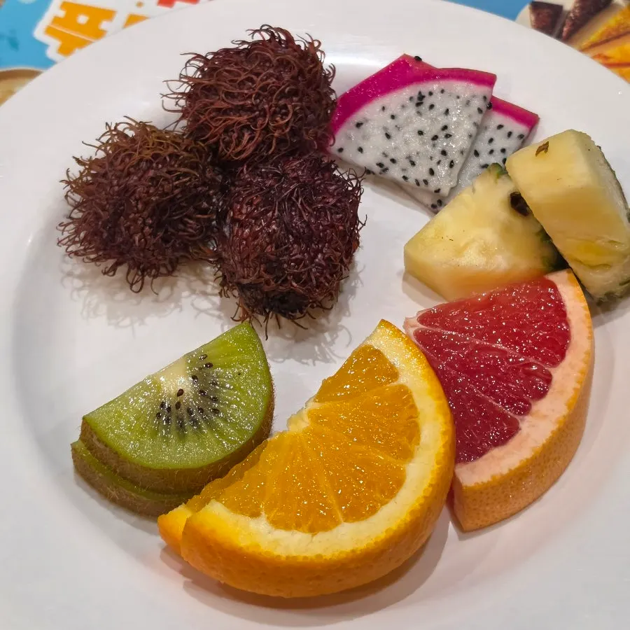Rambutan, dragon fruit and other fruits with blueberry yogurt