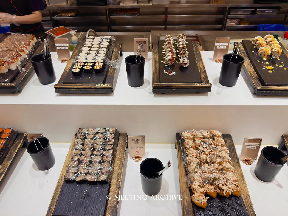 A plate of hand-picked sushi and rolls