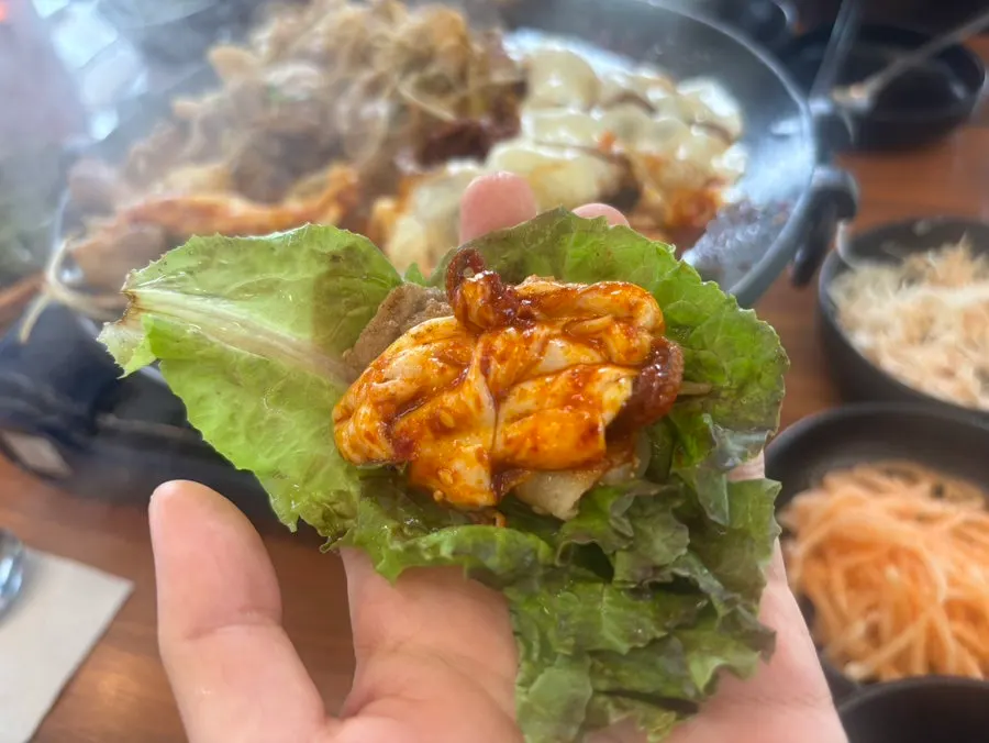 Spicy jjukkumi mixed into melted cheese