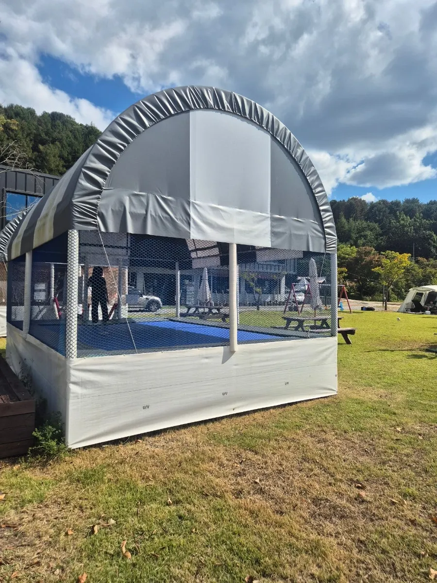 Playground and trampoline in front of the management building