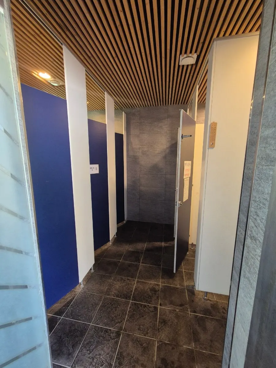 Well-maintained sink and restroom building at the campground