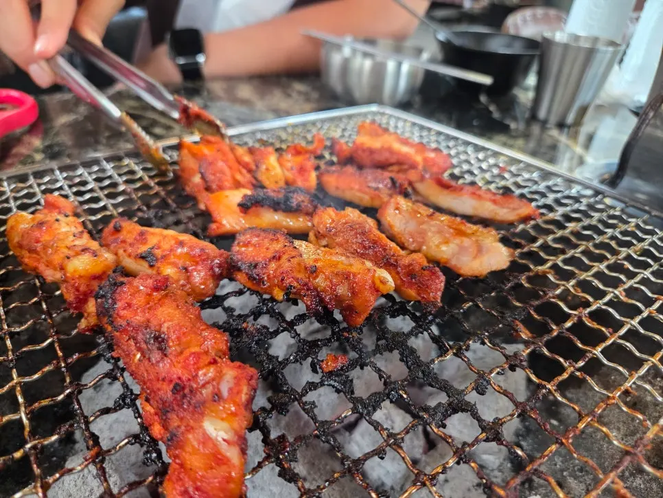 Gochujang-marinated dakgalbi on the charcoal grill