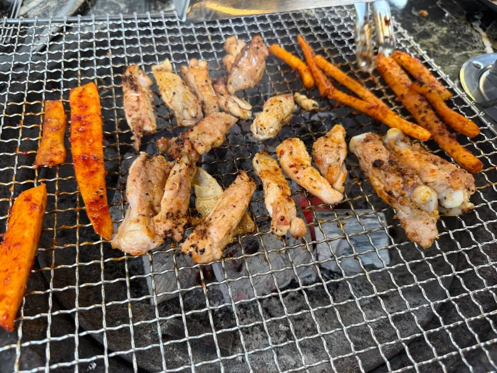 Salt dakgalbi and deodeok on the charcoal grill