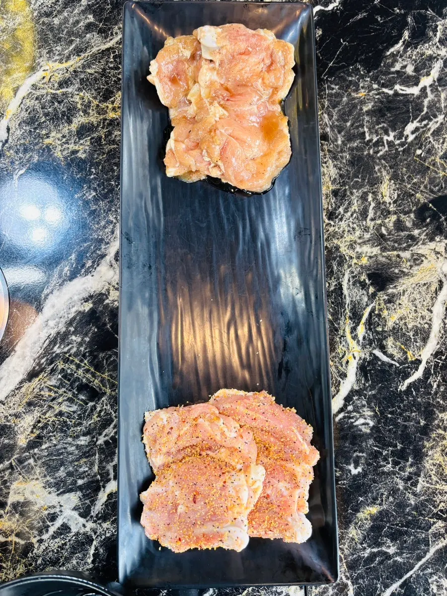 Dakgalbi grilling over charcoal
