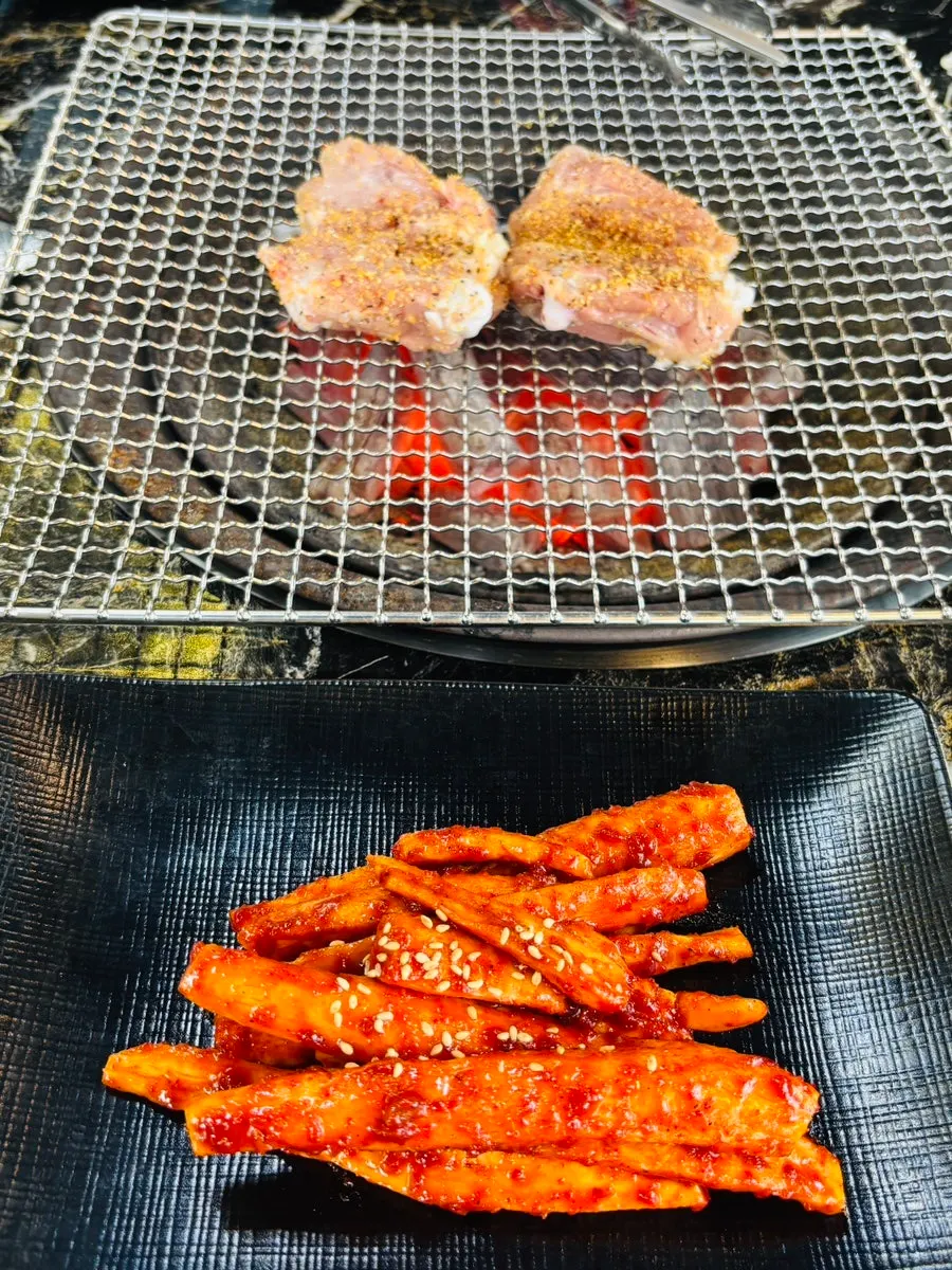 Grilled deodeok cooked over charcoal
