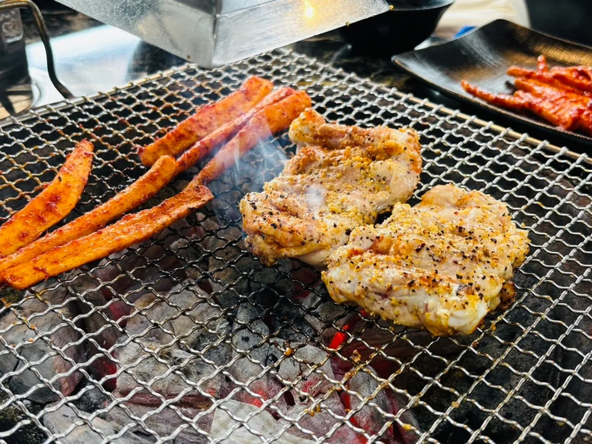 Charcoal-grilled dakgalbi, crisp outside and moist inside