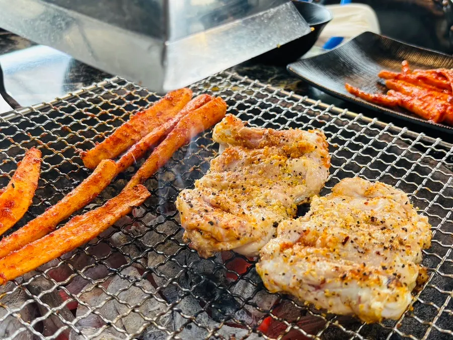 A piece of grilled deodeok included in the set