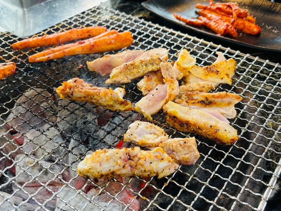 Deodeok grilled alongside the dakgalbi