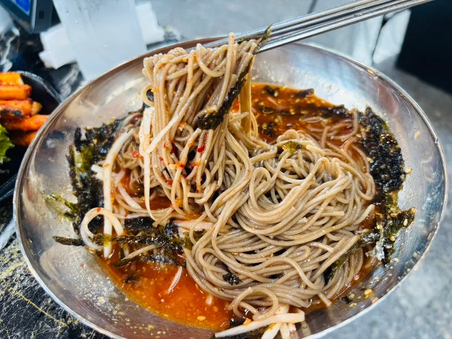 Makguksu noodles tossed with sauce