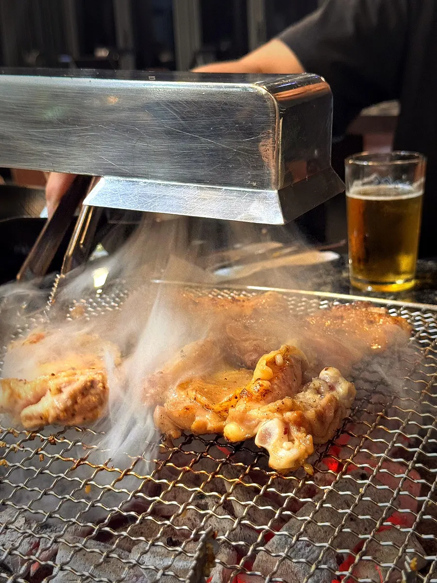 A full spread of charcoal dakgalbi