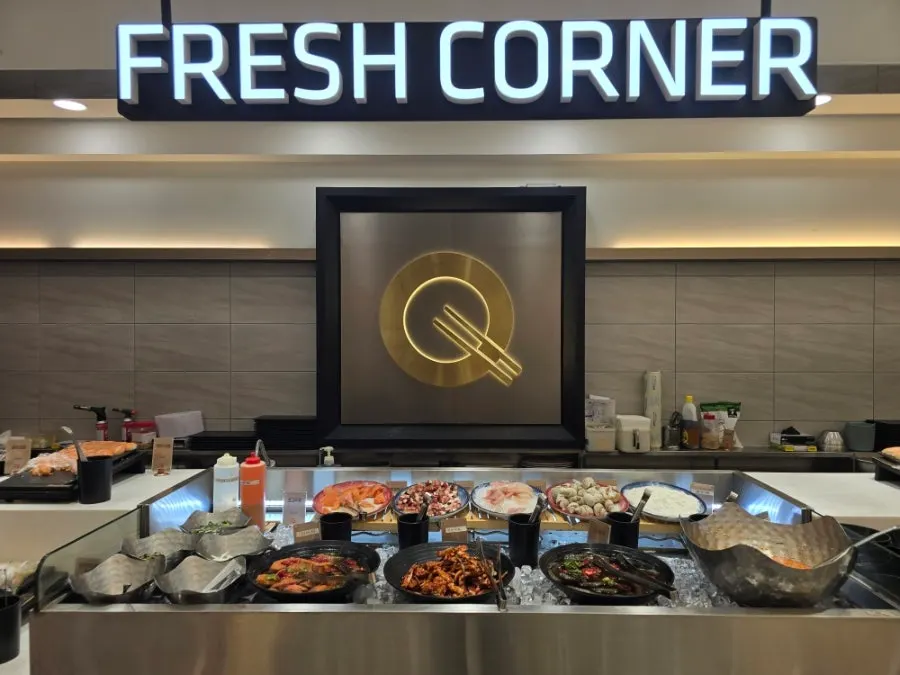 Fresh sashimi corner with salmon, octopus, and marinated shrimp