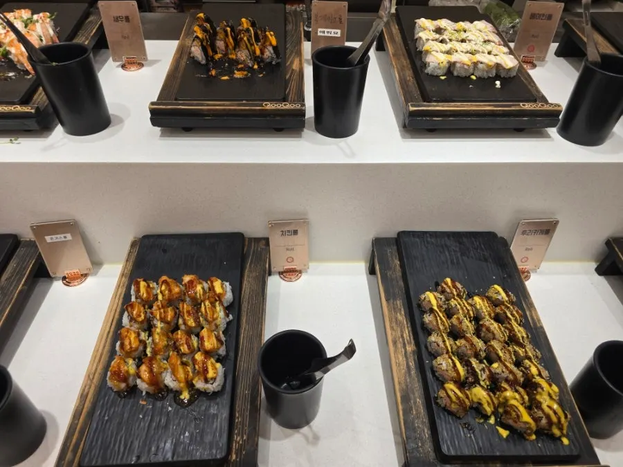 Sushi corner with sushi, gunkan, and rolls on display