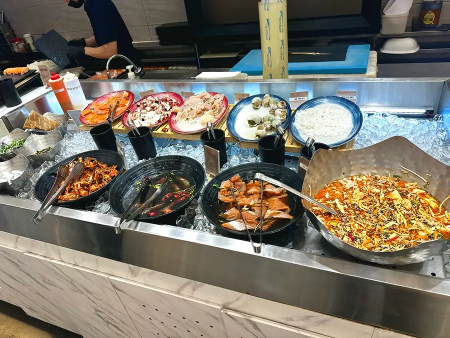 Soy-marinated salmon and seafood station