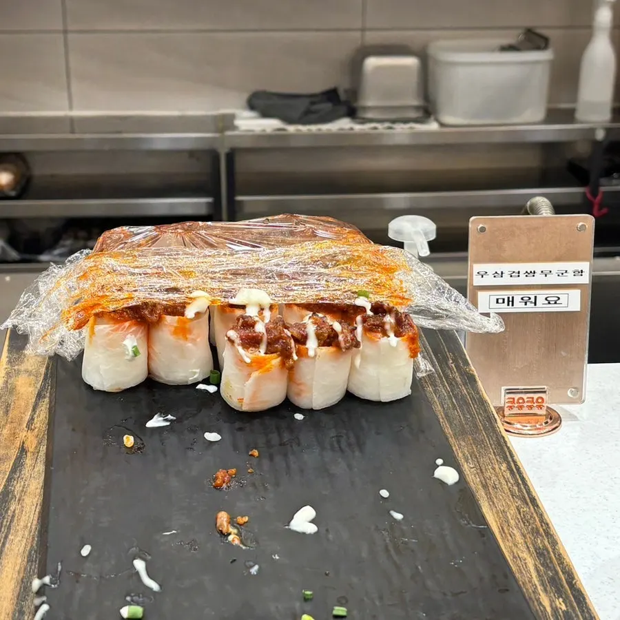 Soy-marinated salmon served with fried rice