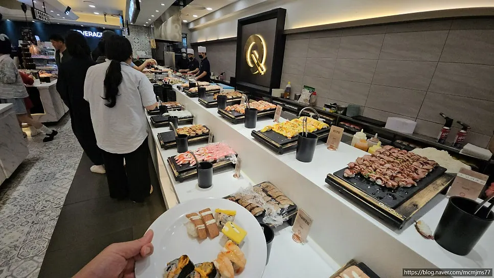 Buffet display case with various sushi
