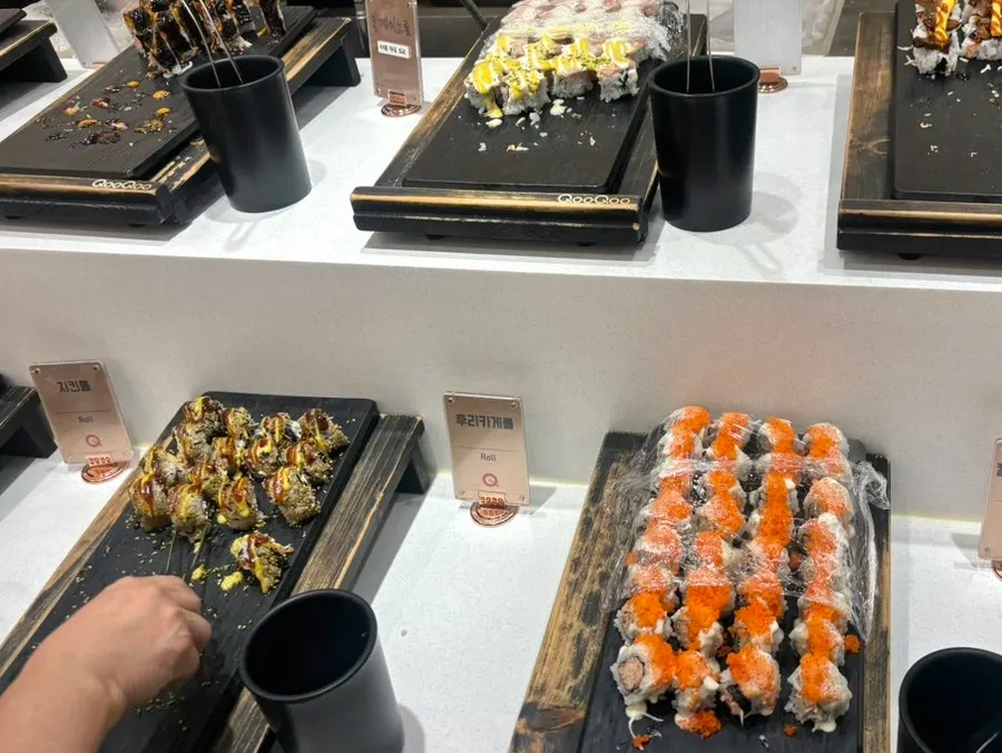 Sushi and gunkan laid out on black slate