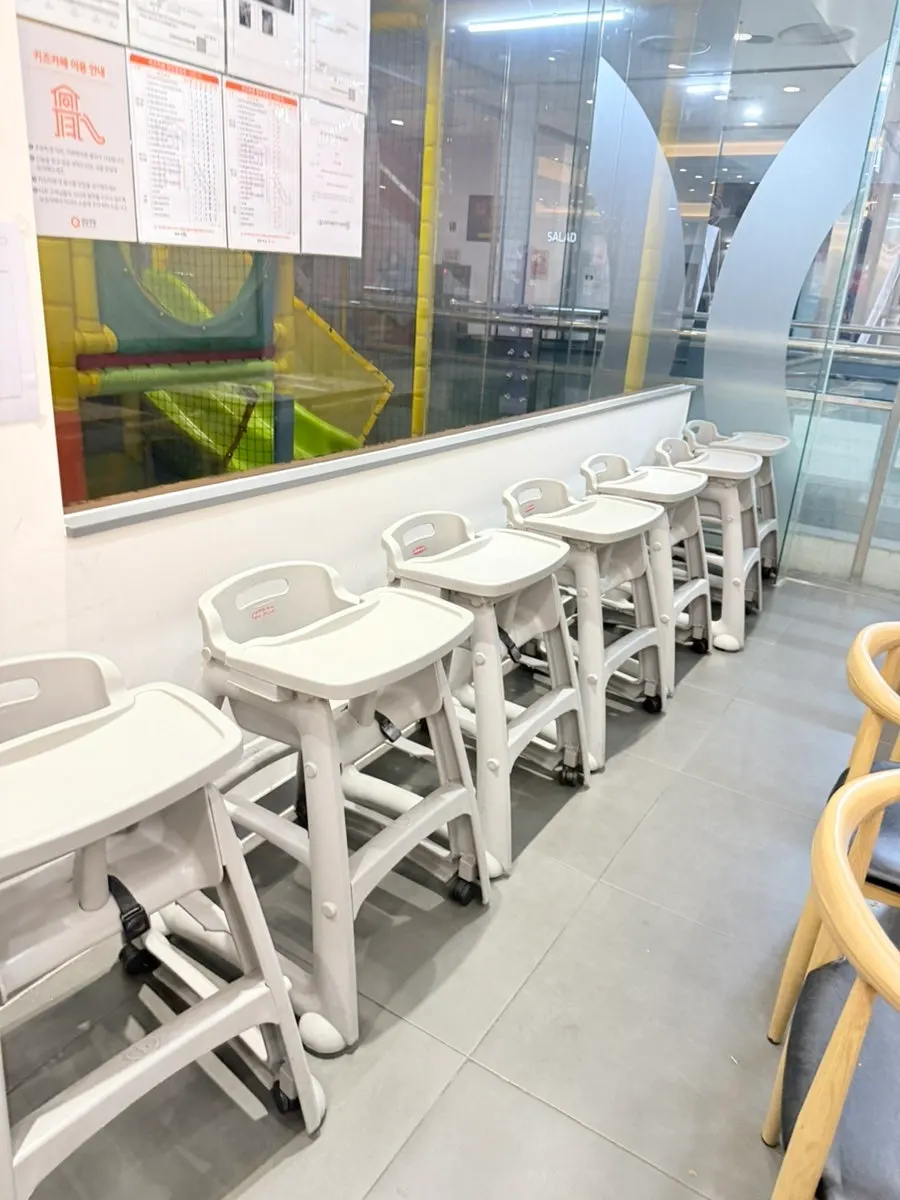 Baby chairs lined up in one section of the store