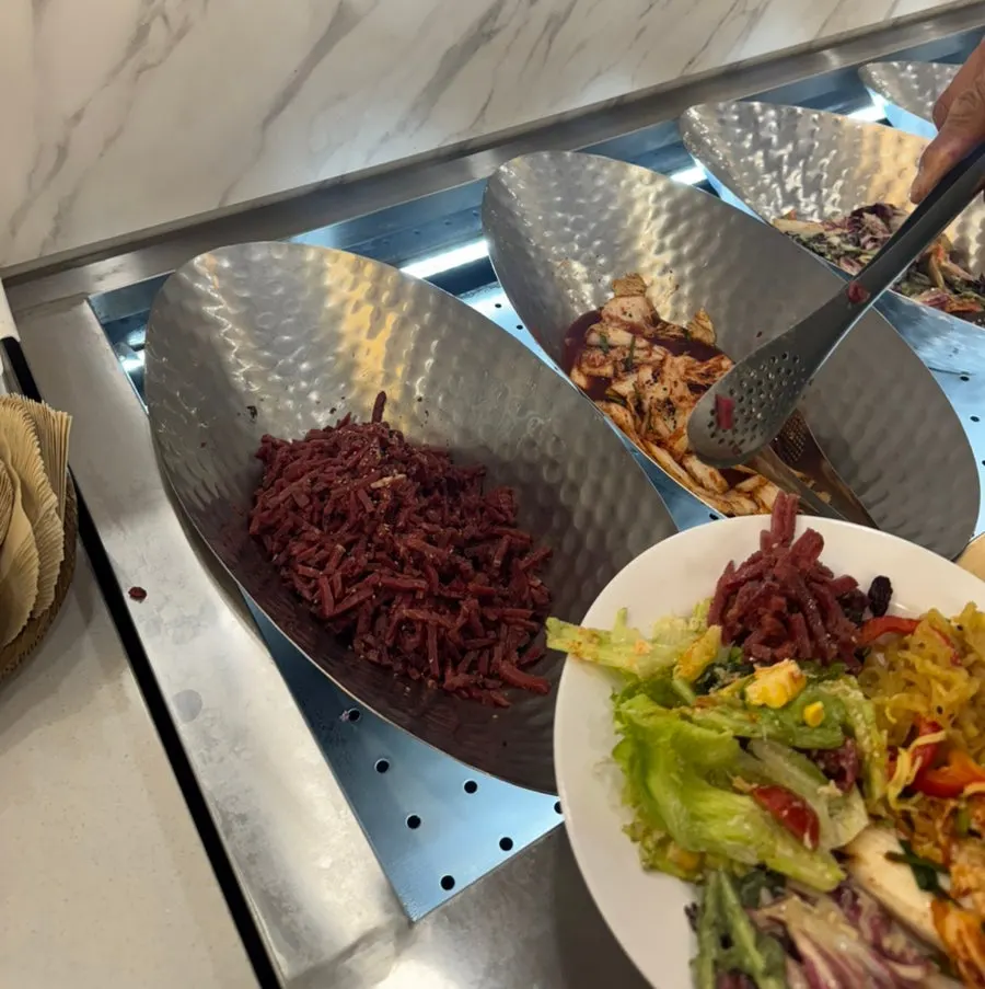 Food laid out on the buffet counter at QooQoo Chuncheon Branch