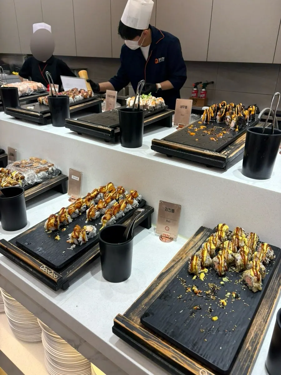 A plate with sashimi sushi and rolls