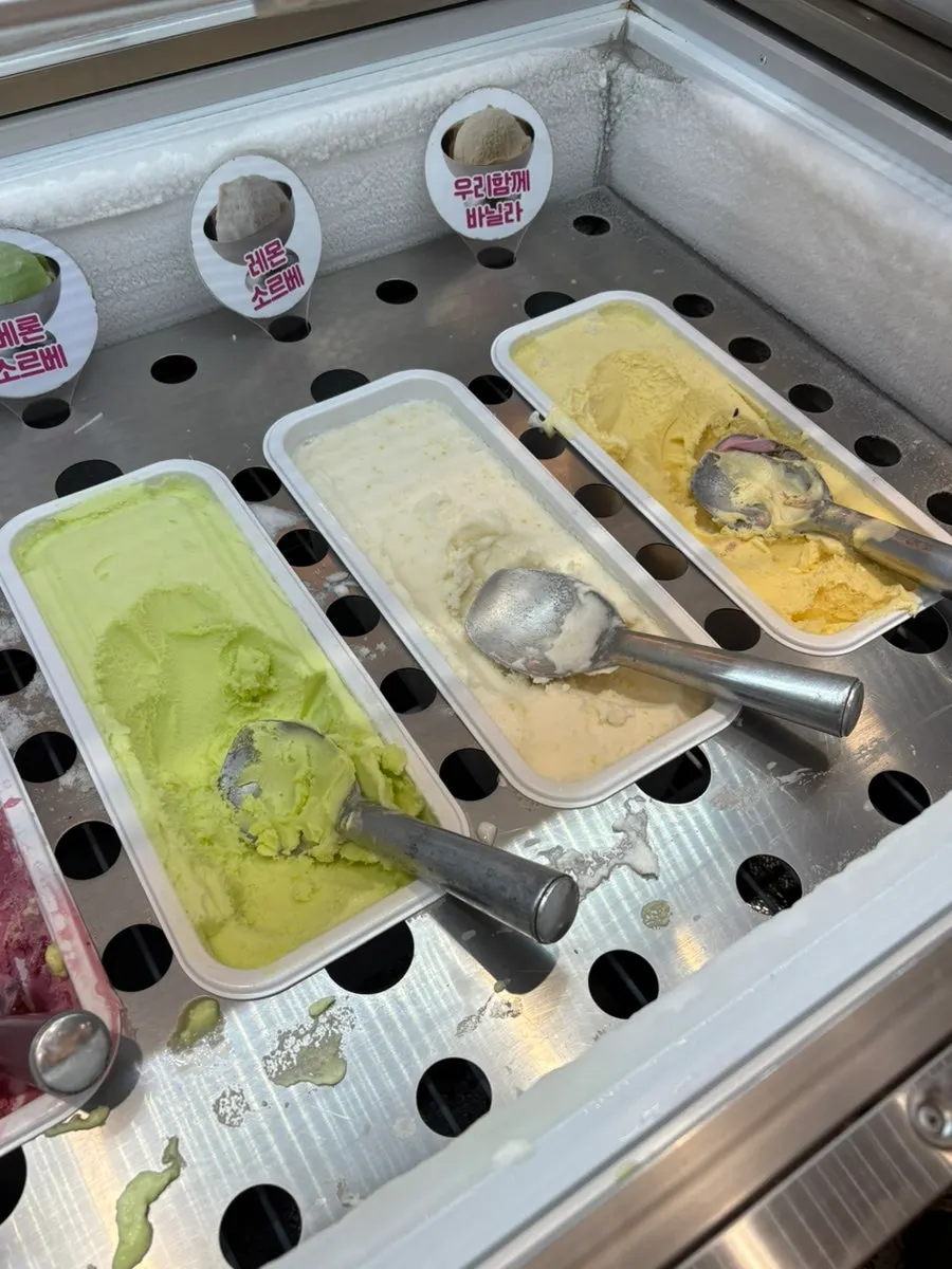 A bowl filled with several ice cream flavors