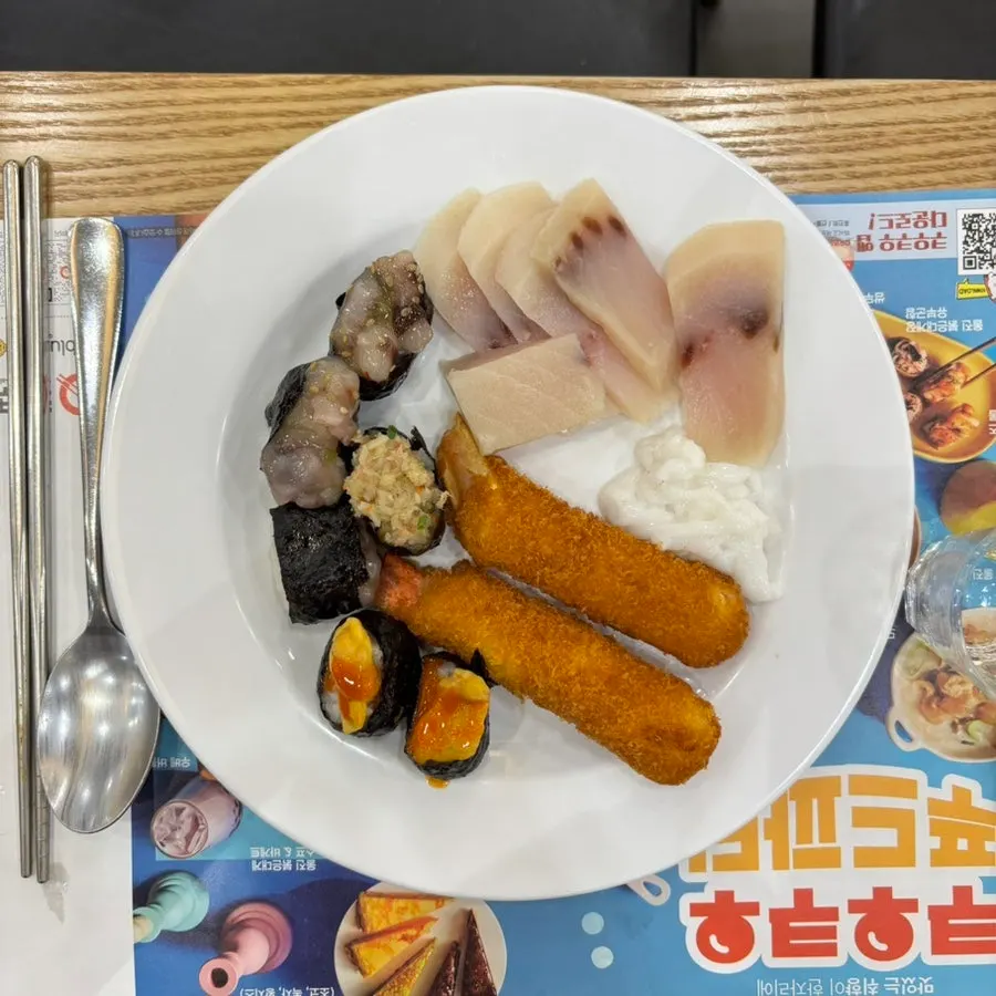 First plate piled with sushi