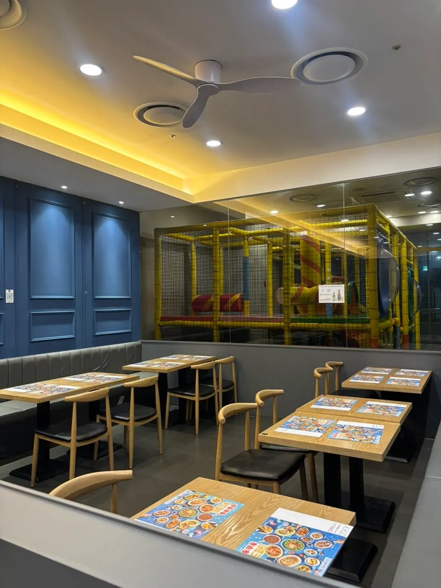 Table seating overlooking the interior of the playroom