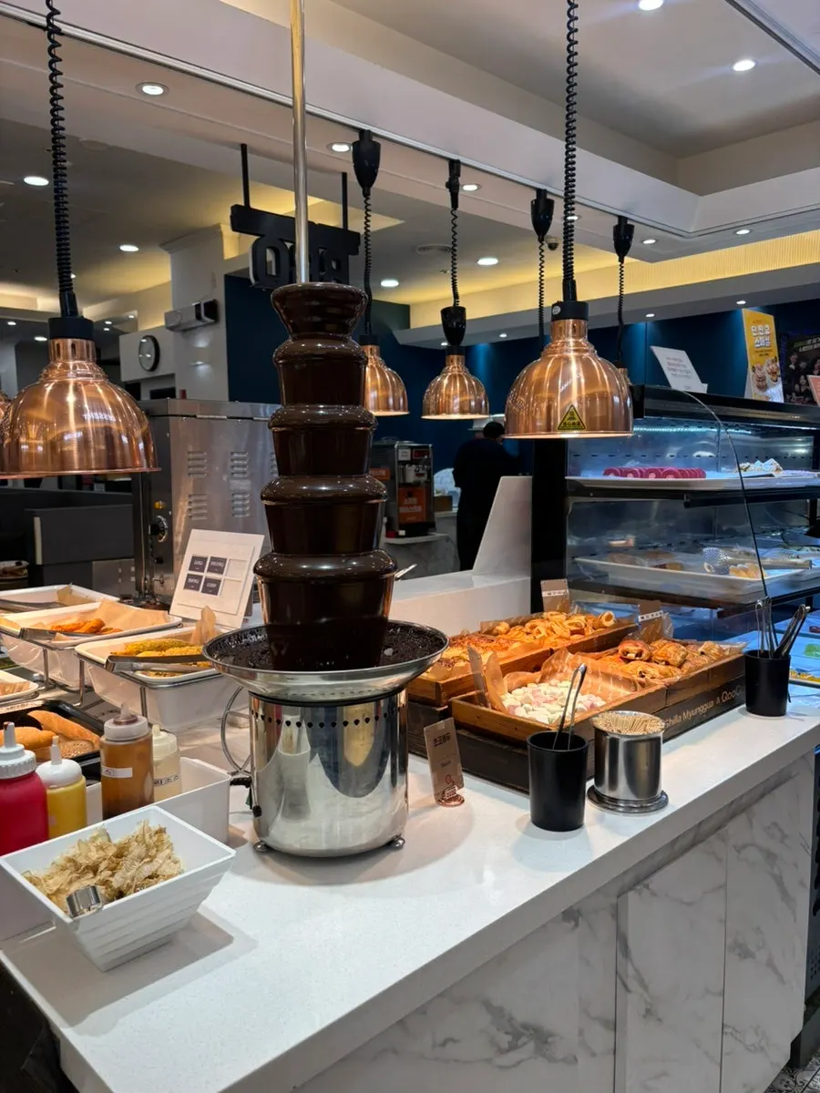 Hot food corner with pizza and fried items