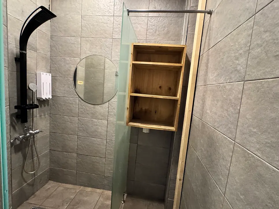 Inside the shower room with amenities provided