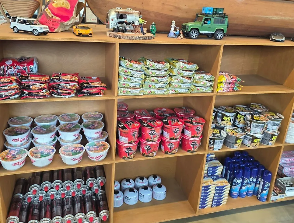 Ramyeon, instant rice, and other groceries displayed in the store