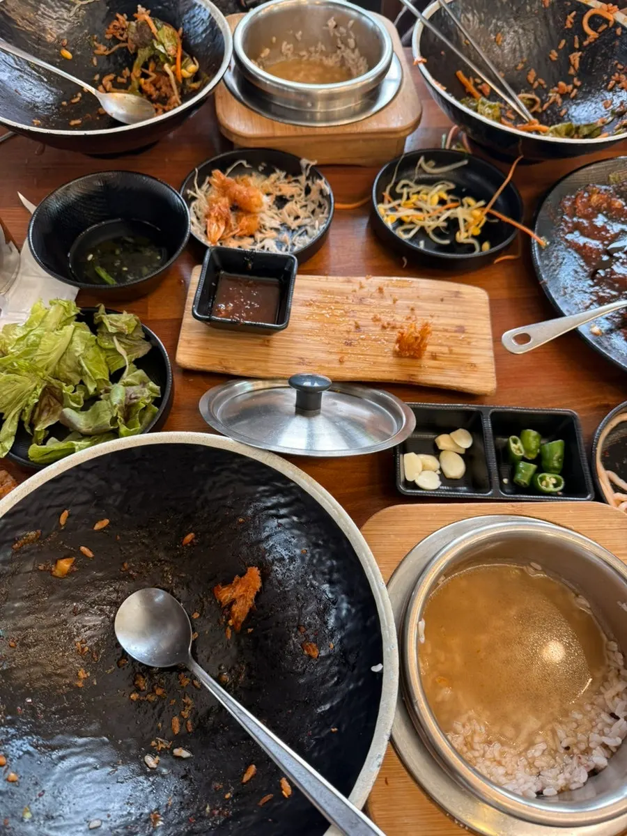 An empty bowl of jjukkumi hot pot rice, scraped clean