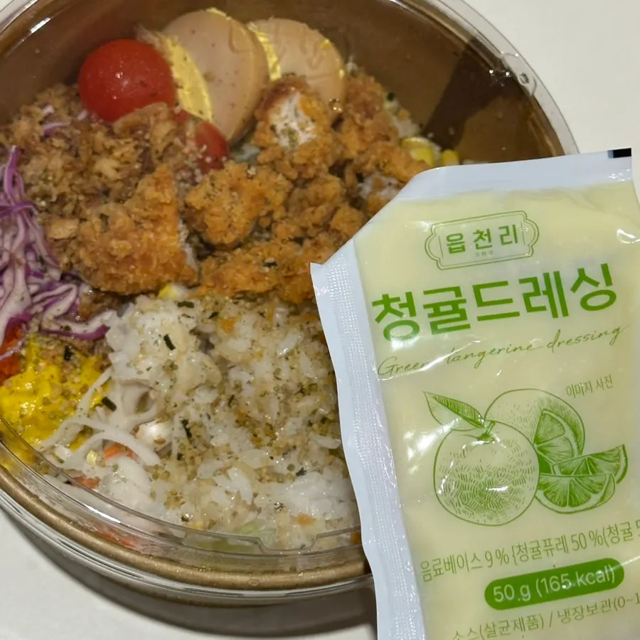 Takeout container of chicken tender poke with citron dressing