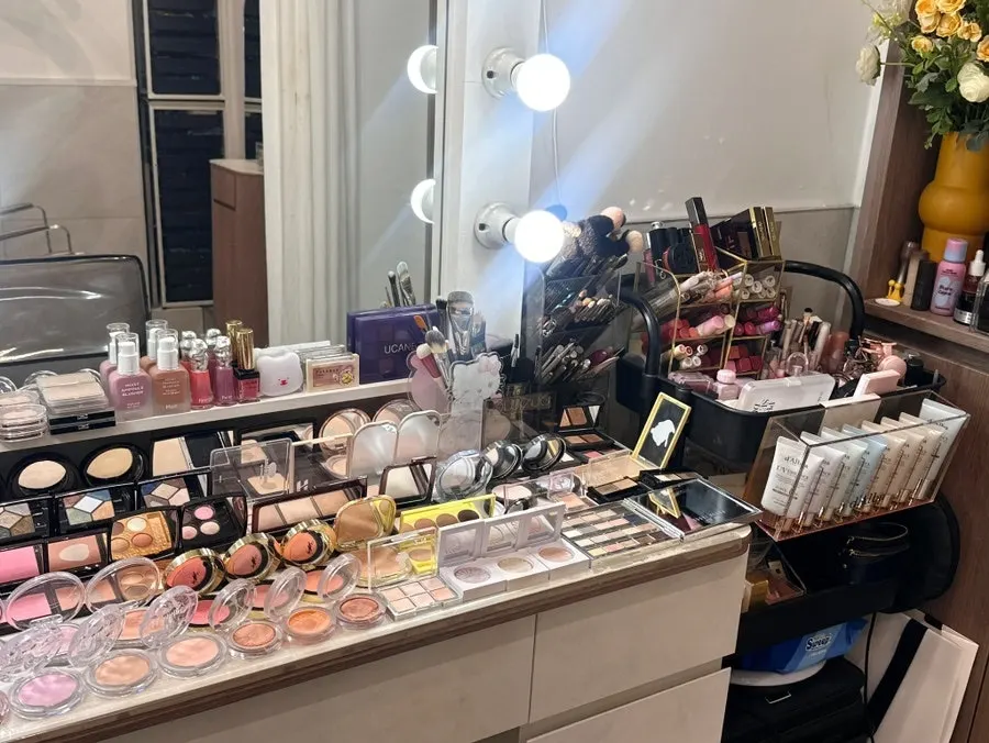 Vanity with makeup brushes and color cosmetics