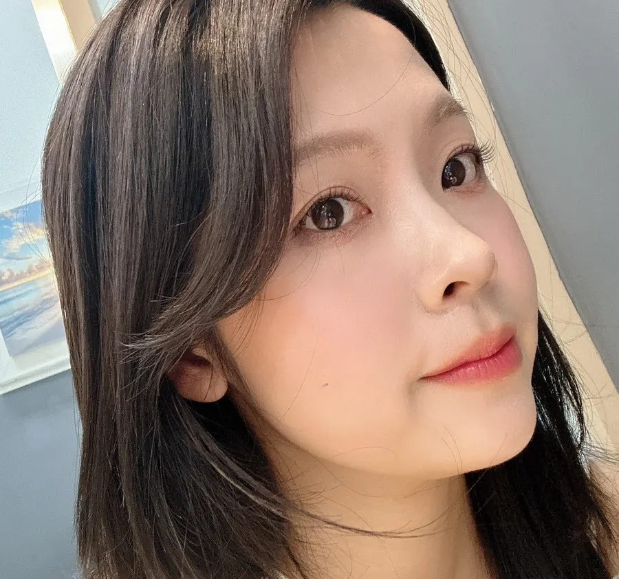 Close-up of subtle blush and pink-toned lip makeup