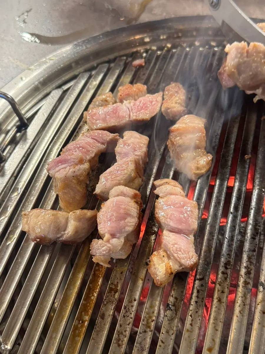 Thick pork neck grilled over charcoal