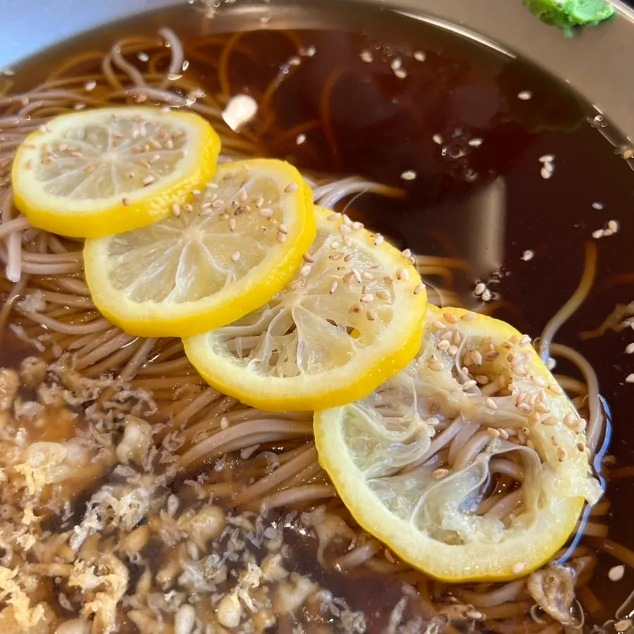 House-made soba topped with lemon