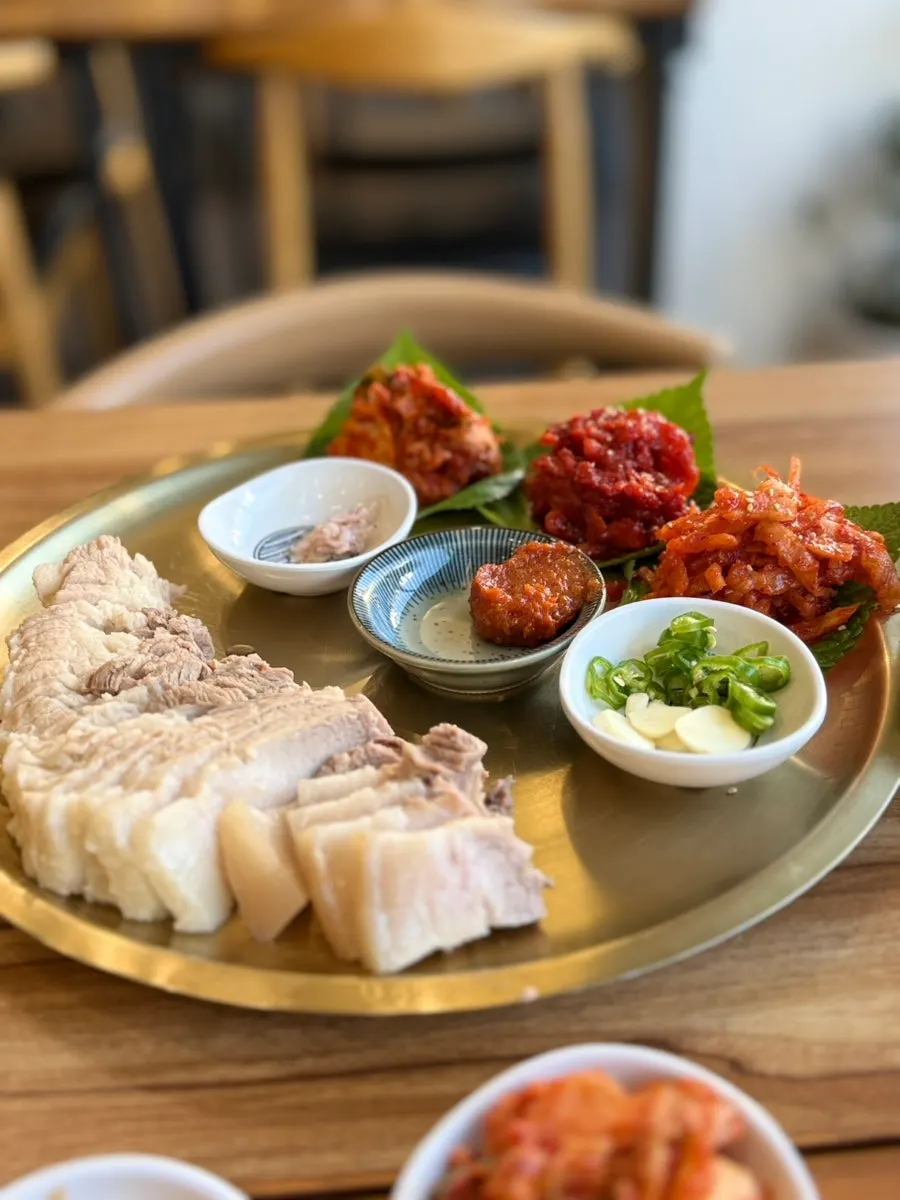 Salted shrimp, ssamjang, garlic and other bossam accompaniments