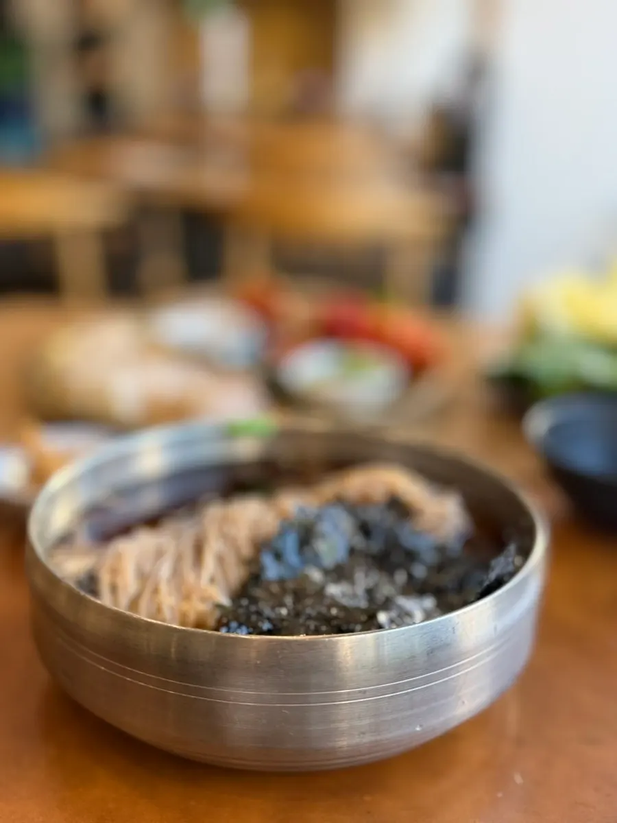 House-made Jeonju-style soba topped with seaweed and sesame seeds