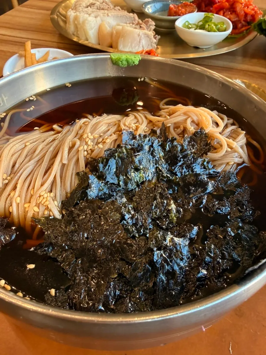 Close-up of noodles lifted from the Jeonju-style soba