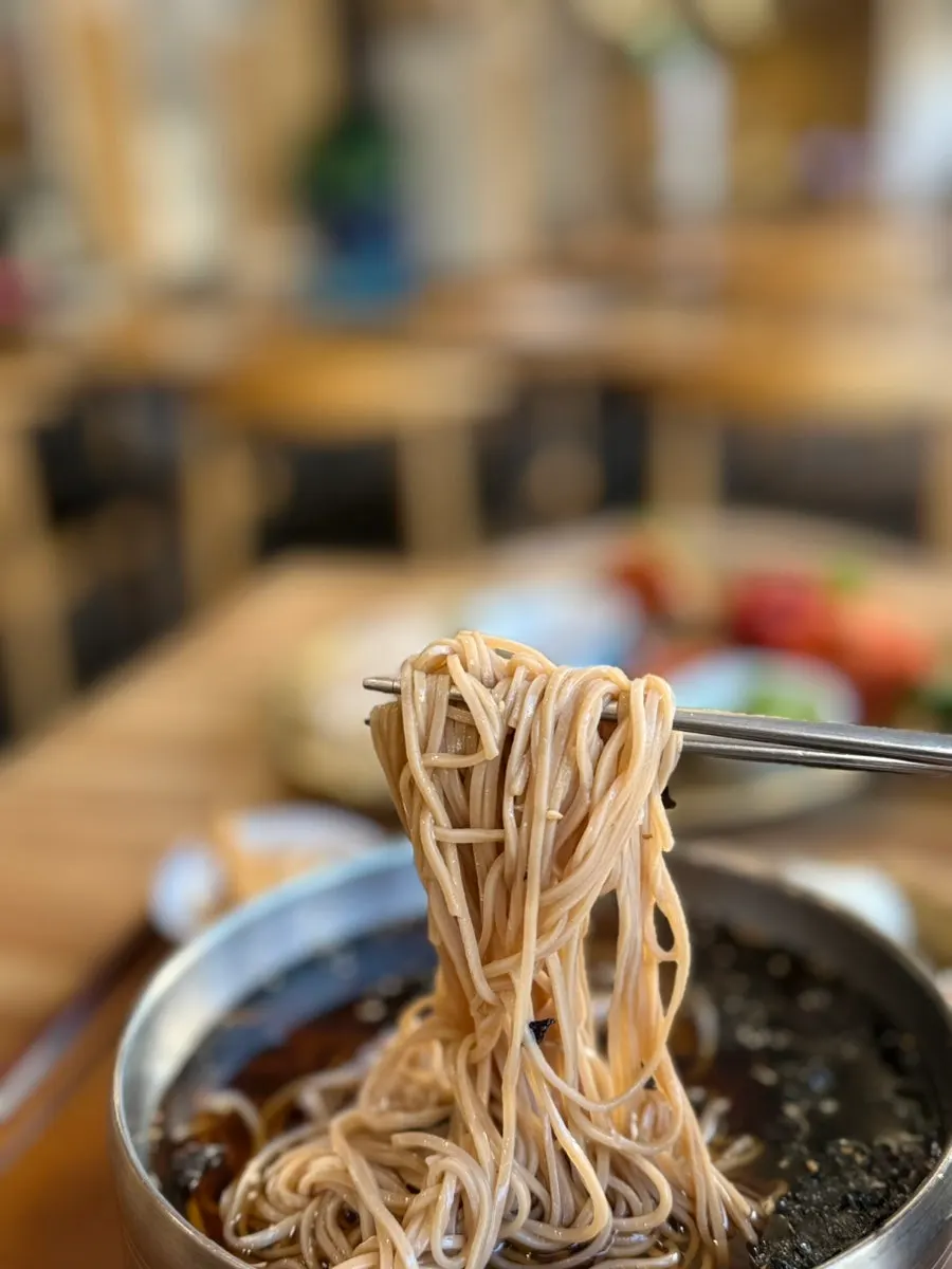 Full table with soba and bossam served together