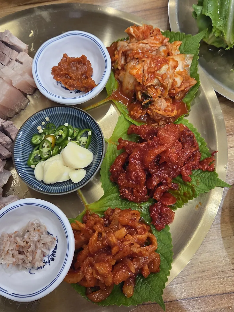 Boiled pork bossam slices with visible grain